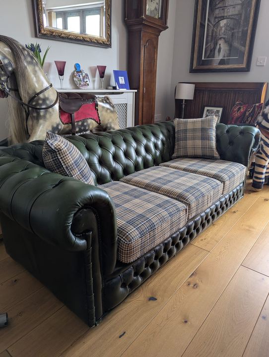 The Chesterfield after, with new seat cushions in a woven check