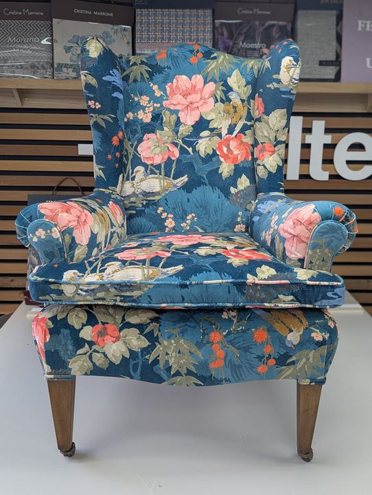 Wingback armchair re-upholstered in a blue botanical print