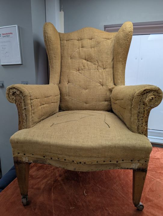 The wingback stripped back to hessian